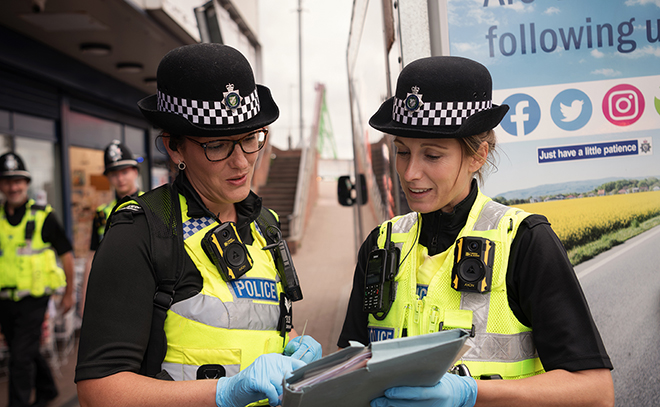 Police officers - looking at paperwork in street (Kat Braithwaite - Amy Brigginshaw).jpg