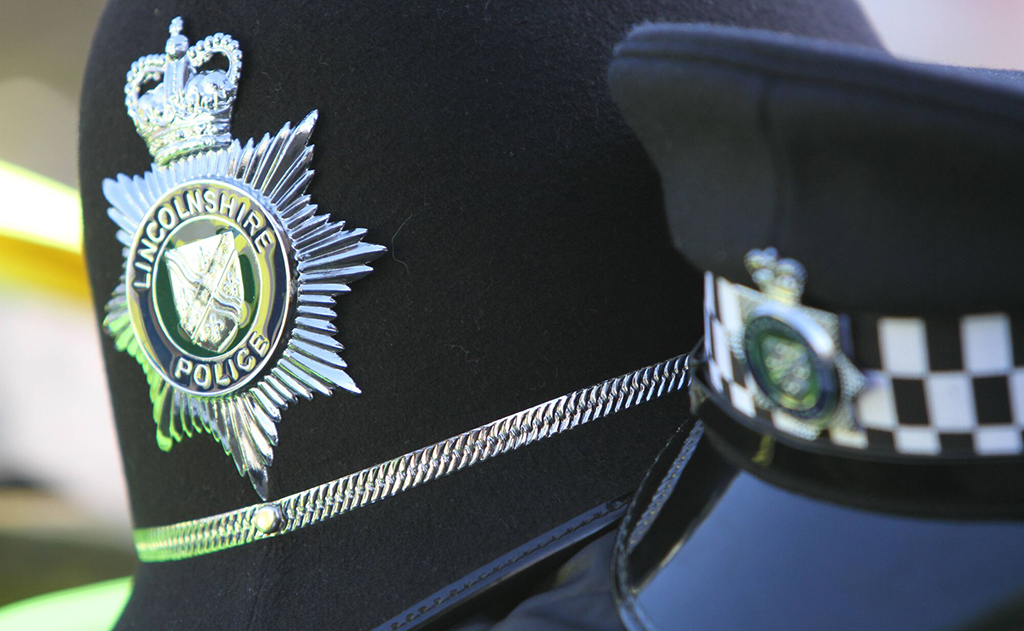 Police officer uniform - helmet and hat with Lincs crest